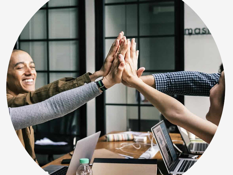 partner and team members high-fiving 